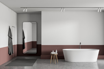 White and red bathroom with tub and mirror