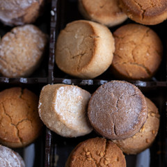 Variety of Spanish shortbreads Mantecados, polvorones, nevaditos in black box. Typical sweets consumed at Christmas time in Spain.