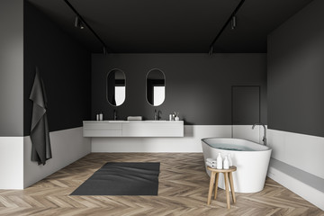 Gray and white bathroom with tub and sink