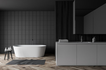 Fototapeta na wymiar Gray tile and wood bathroom, tub and sink