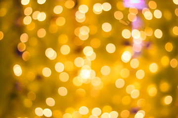Abstract yellow bokeh on blurred background.
