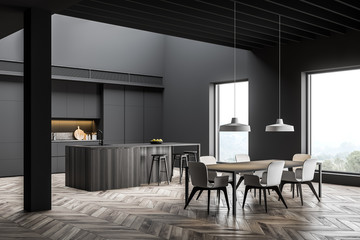 Gray kitchen corner with bar and dining table