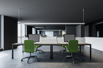 Gray open space office with green chairs
