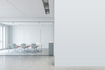 White conference room with mock up wall