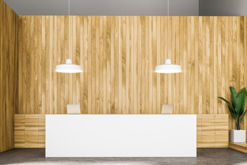 White reception desk in wooden office