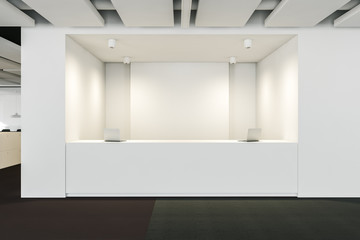 Long white reception desk in modern office
