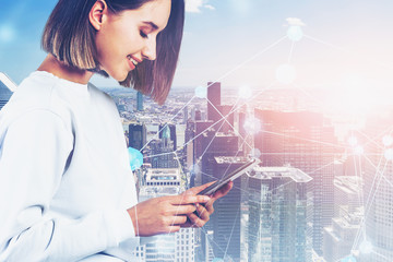 Casual woman in city with tablet, network