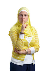 Beautiful Muslim Woman with Silence Gesture Isolated on White