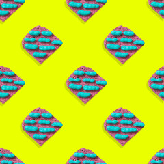 Pattern of peanuts painted in blue lies on pink toast with strong shadows. the concept of Breakfast. minimal flat lay.