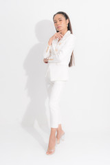 Asian business woman wearing white work suit are standing strive, looking at the front  isolated on white background and shadow.