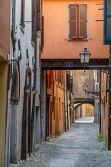 Narrow old street in the historic centre of Ferrara, Italy