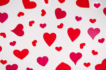 Background of red and pink hearts on white background. Valentine's day love holiday. Holiday card