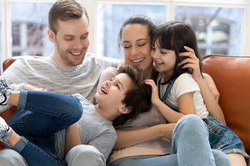 Obraz premium Happy mother and father hugging enjoying and having fun.