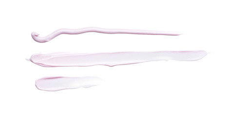 Gently pink strokes and texture of face cream or acrylic paint isolated on white background