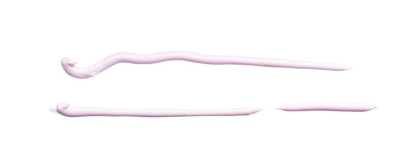Gently pink strokes and texture of face cream or acrylic paint isolated on white background