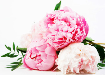 Close up  bouquet of fresh beautiful flowers lies on a white background . Horizontal photo.