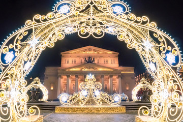 Moscow. Russia. Bolshoi theatre on the background of Christmas decorations. New Year in the capital of the Russian Federation. Festive evening in Moscow. Ornaments of luminous garlands.