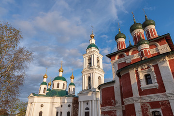 The upper parts of the Feodorov and Smolensk churches photographed on a sunny autumn evening