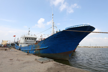 Wooden fishing boats moored on the shore