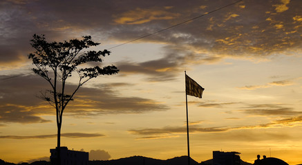Vietnamese national flags against sunset sky