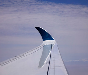 Wing of airplane with blue winglet