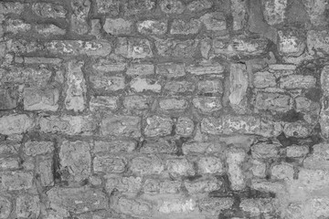 Black and white photography of old vintage brick wall. Horizontal image.