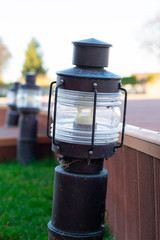 Decorative Small Solar Garden Light, Lanterns In Flower Bed. Garden Design. Solar Powered Lamp