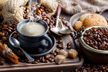 Black coffee on an old background in a cup