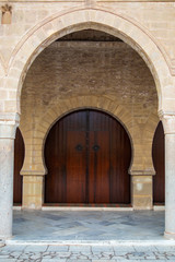 Front door of ancient Mosque. Tunisia. Vertical color photography.