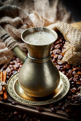 Black coffee on an old background in a cup