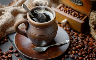 Black coffee on an old background in a cup