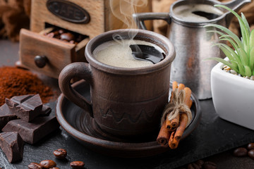 Coffee in a cup and saucer on an old background.