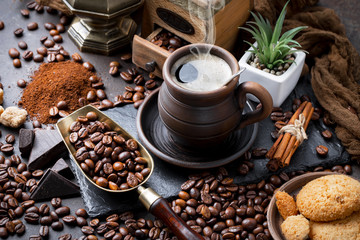 Coffee in a cup and saucer on an old background.
