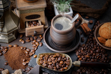 Coffee in a cup and saucer on an old background.