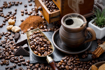 Coffee in a cup and saucer on an old background.