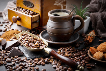 Coffee in a cup and saucer on an old background.