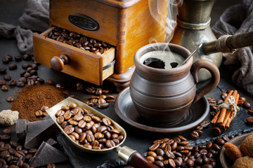 Black coffee on an old background in a cup