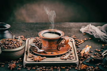 Black coffee on an old background in a cup