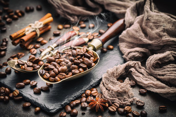 Coffee in a cup on a background of coffee beans, on an old background.