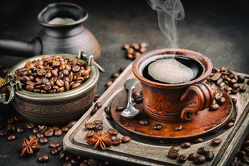 Black coffee on an old background in a cup