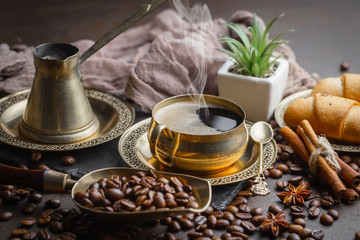 Black coffee on an old background in a cup