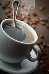 Black coffee on an old background in a cup
