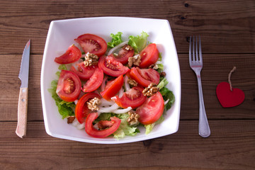 diet concept. bowl of lettuce, tomato and onion