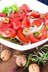 lettuce, tomato and walnut salad diet and food concept