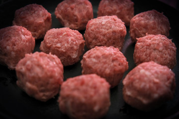 Semifinished. Frozen Meatballs. Preparation for cooking. Selective focus.