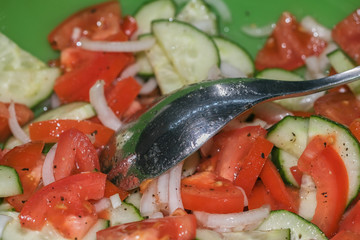 Cucumber salad with tomatoes. Close-up. Selective focus.