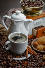 Coffee in a cup and saucer on an old background.