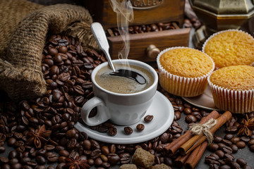 Coffee in a cup and saucer on an old background.
