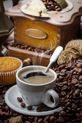 Black coffee on an old background in a cup