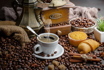 Black coffee on an old background in a cup